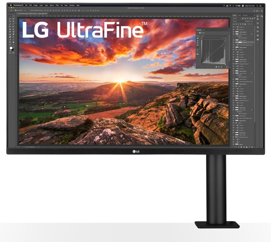 Monitor LG UltraFine na czarnym stojaku wyświetlający kolorowy krajobraz i elementy UI.