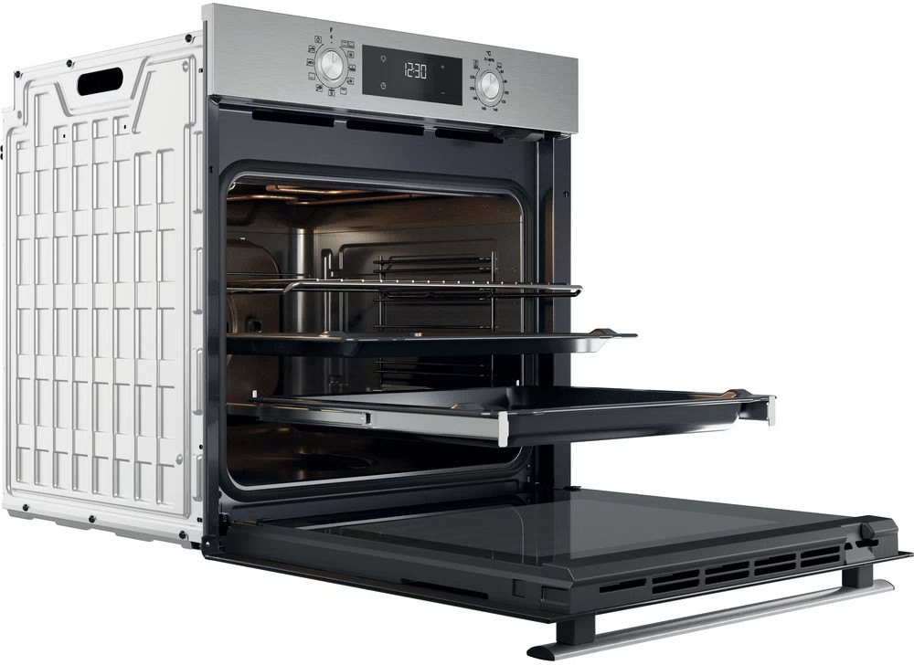 Open oven with shelves and a tray, with control panel at top, white interior.