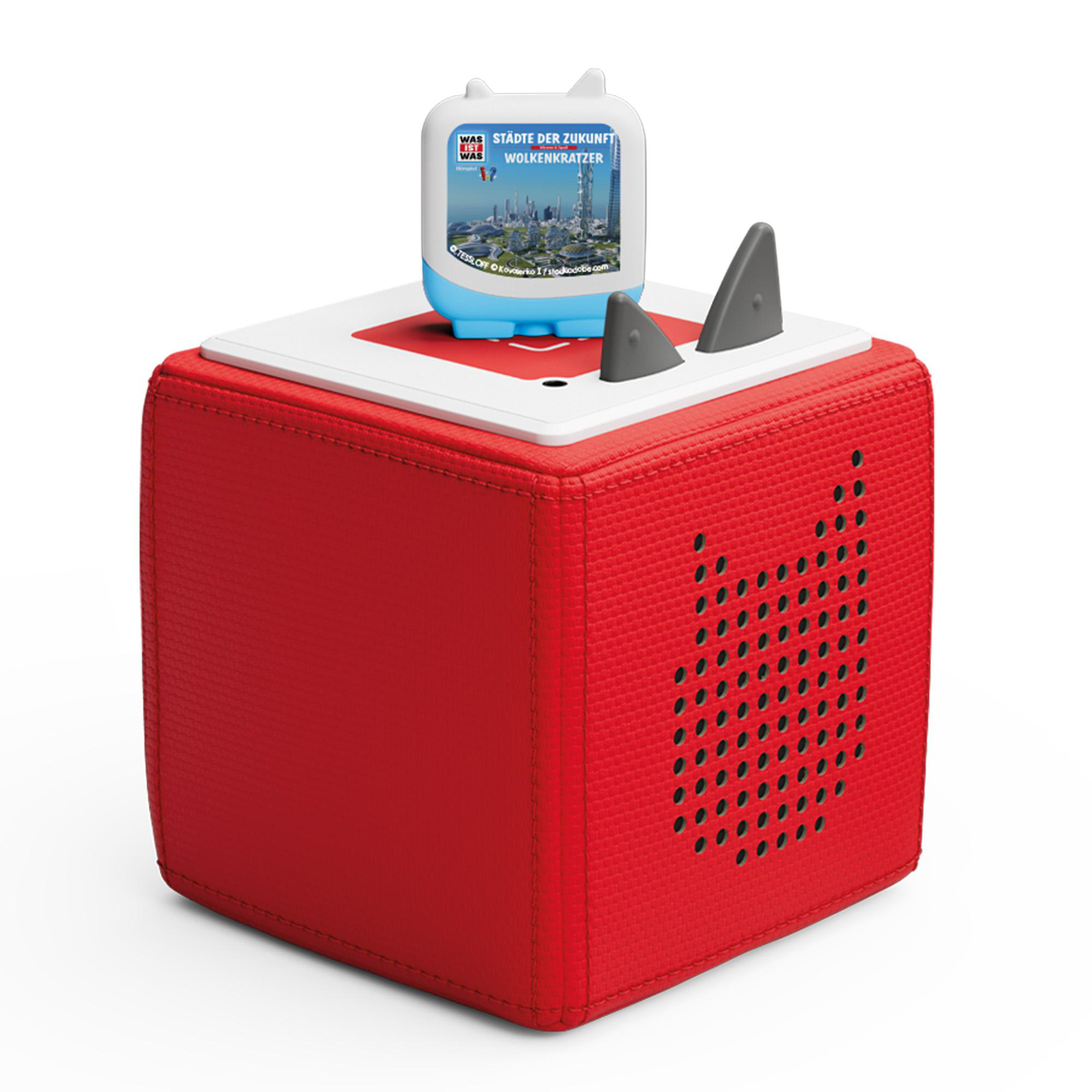 Ein roter Würfel mit weißer Oberseite und einem blauen Spielzeug darauf.