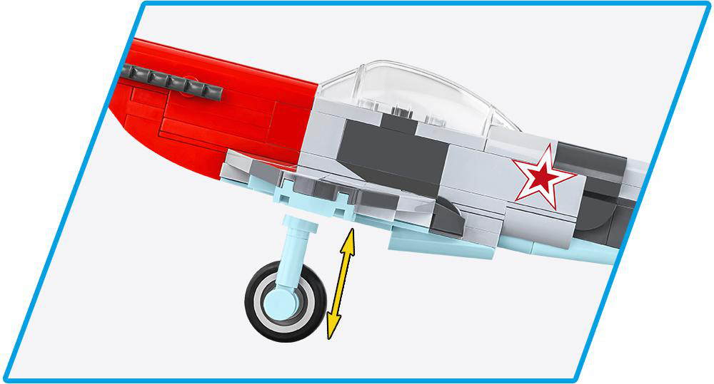 Ein Spielzeugflugzeug mit roten und grauen Teilen, mit einem Pfeil, der das Fahrwerk zeigt.