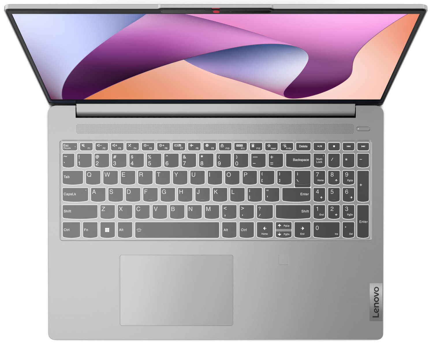 Laptop van bovenaf. Het scherm toont roze en witte abstracte vormen. Toetsenbord zichtbaar. Lenovo-logo.