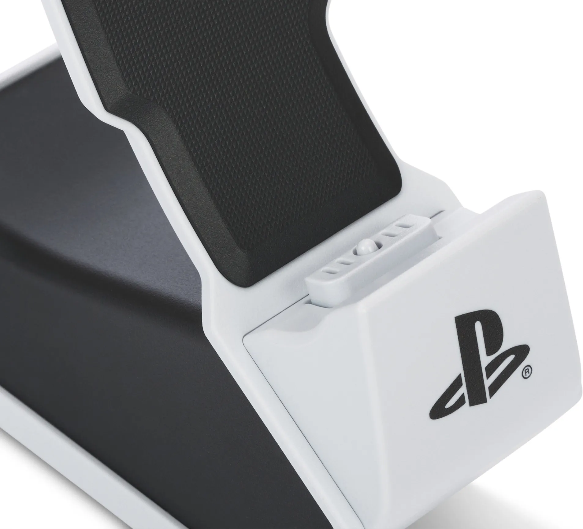 Gros plan sur une station de charge Playstation 5 blanche et noire avec le logo Playstation.