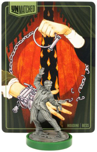 Kártya Houdini figurával, láncokkal és egy kézzel, amely egy kulcsot tart egy színpad-szerű háttéren.