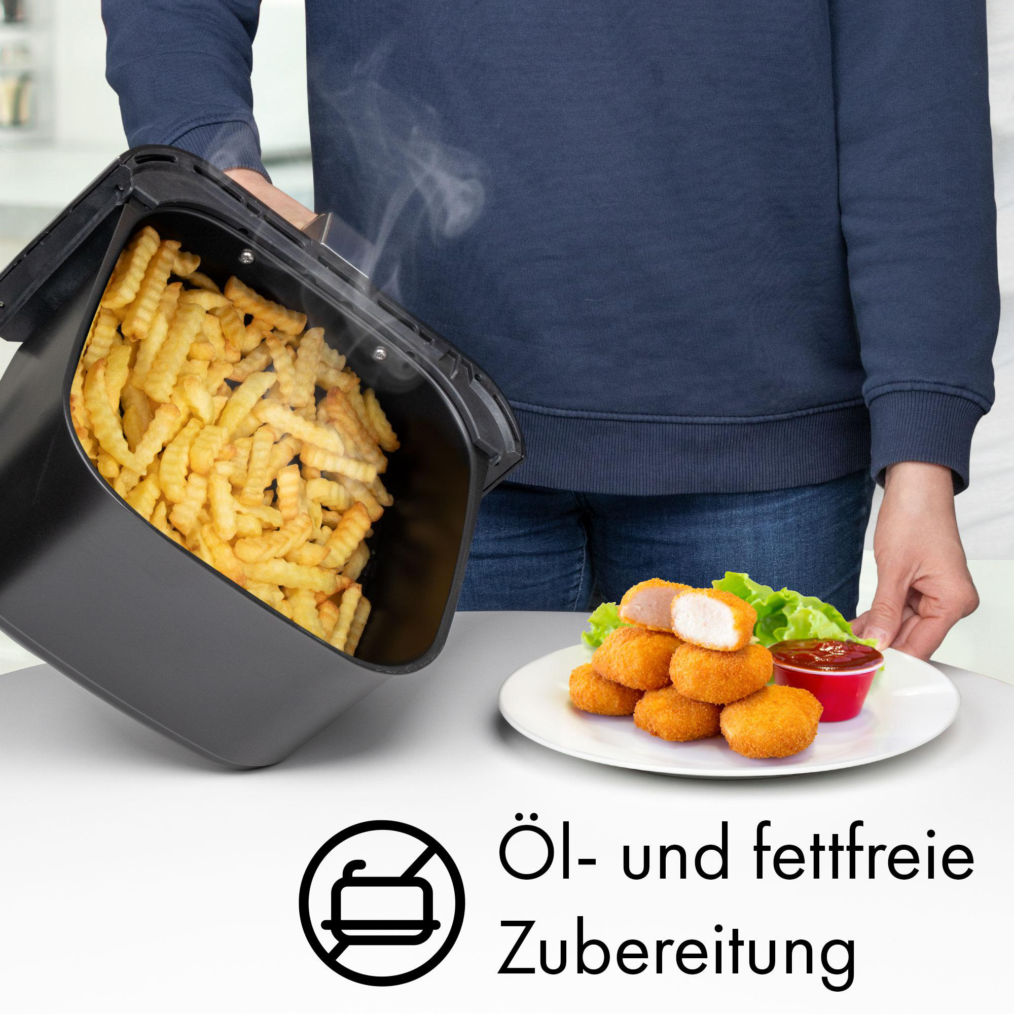 Heißluftfritteuse mit Pommes und Chicken Nuggets auf einem Teller, Text deutsch.