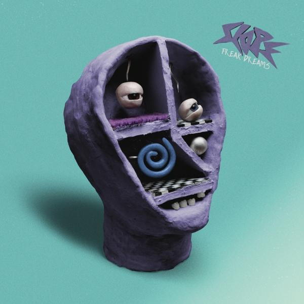 Album borító. Lila fej szemekkel. Kék háttér. Szöveg: Freak Dreams.