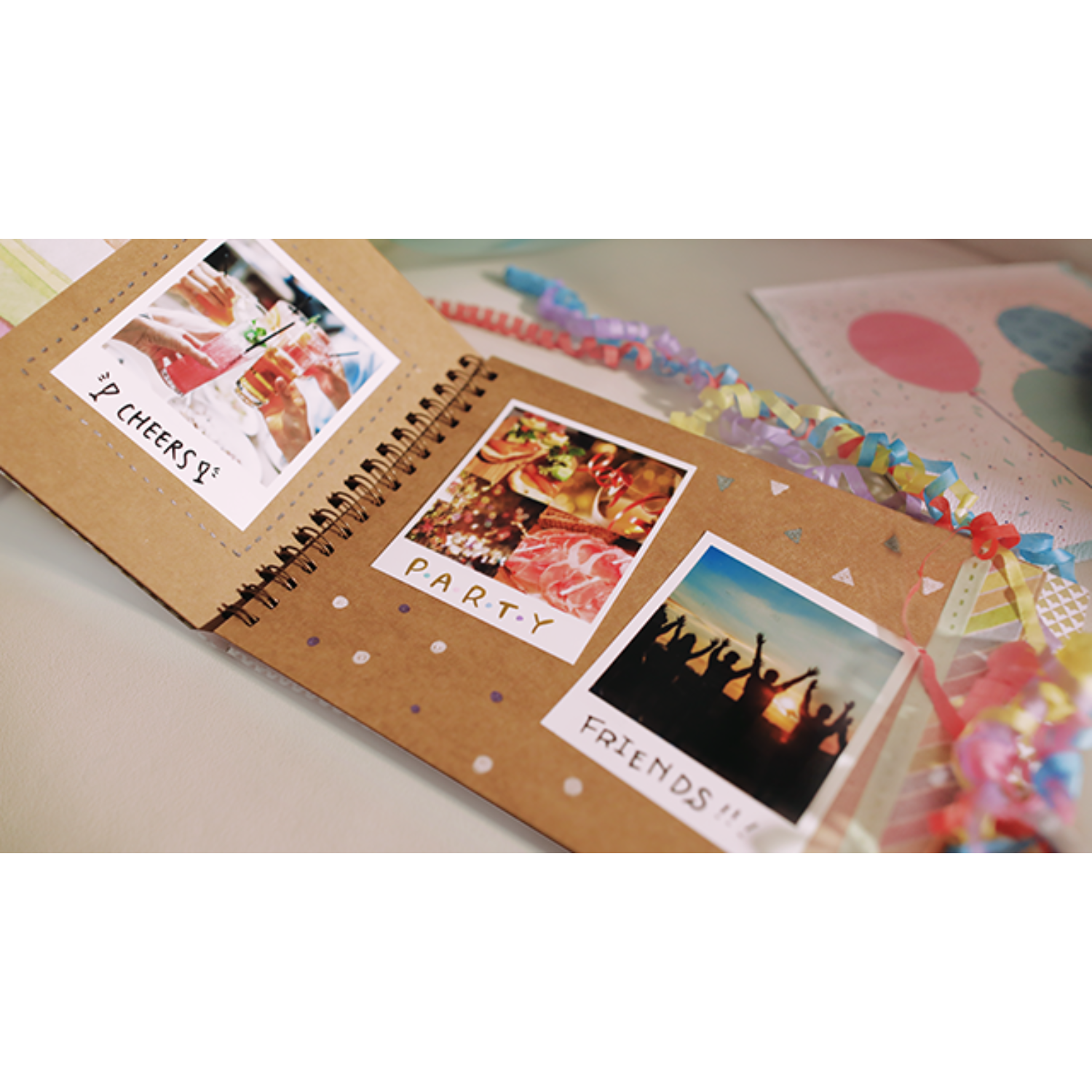 A scrapbook with photos, text, and a spiral binding.