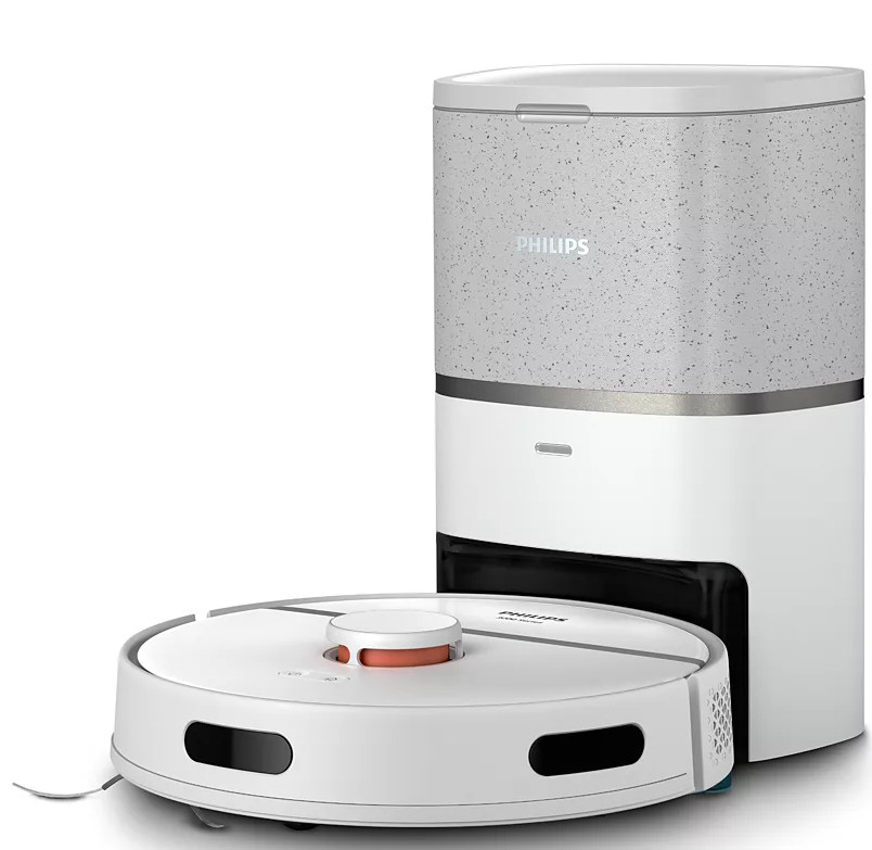 Biały odkurzacz automatyczny i jego stacja ładująca. Baza ma szary wierzch.