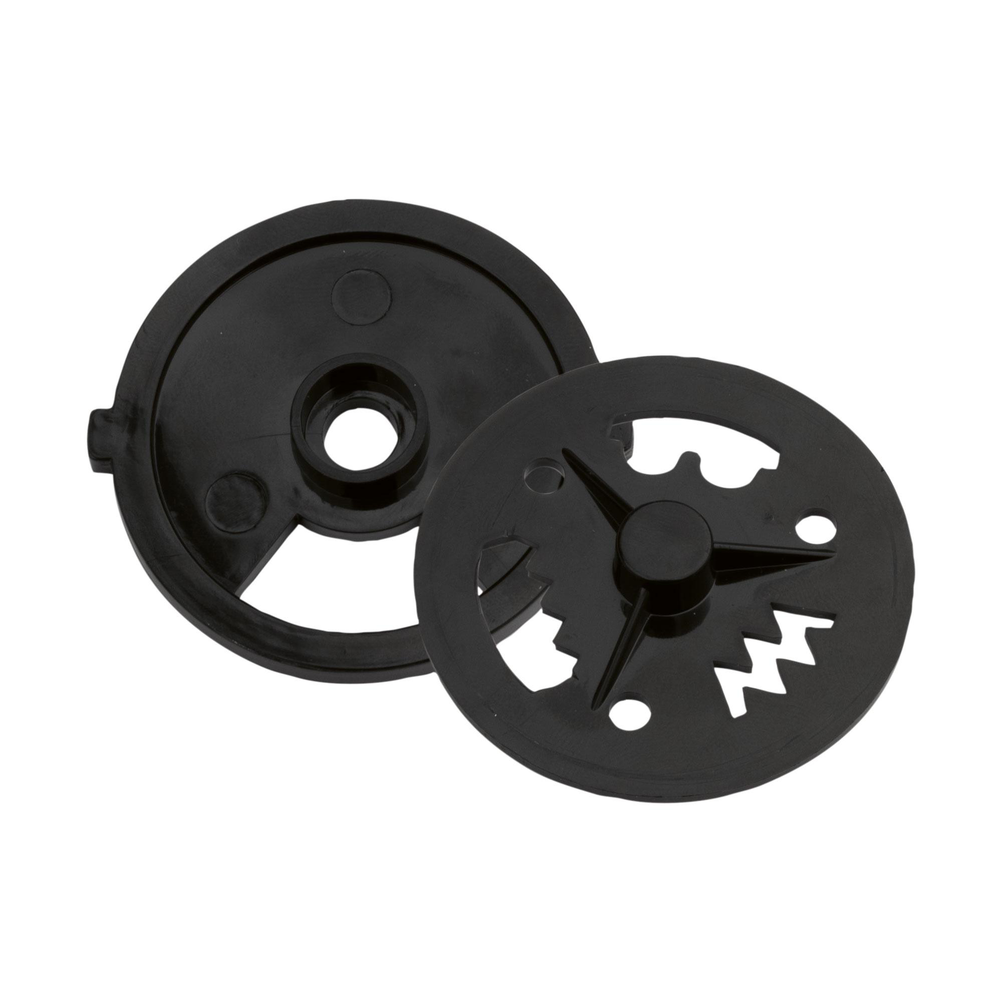 Zwei schwarze Plastikscheiben, eine mit geschlitztem Design.