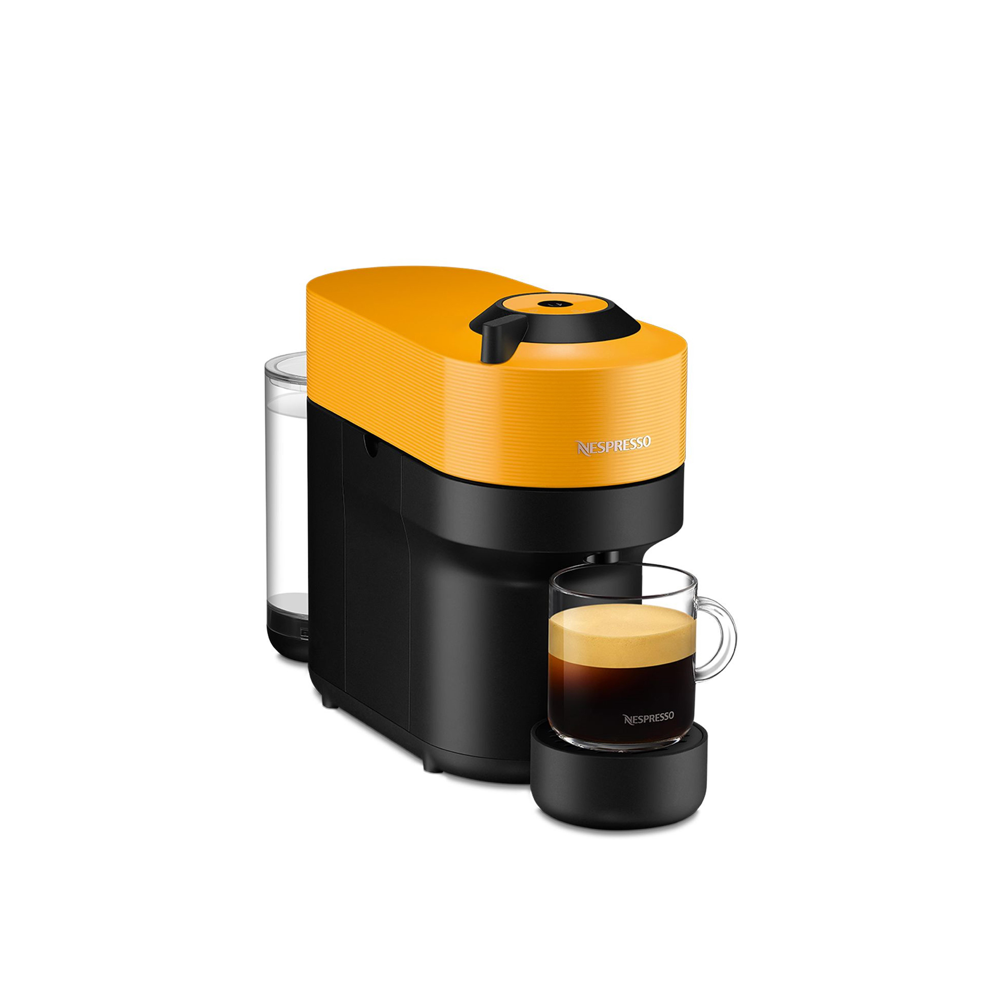 Ekspres do kawy z żółtą górą i czarną podstawą, szklanka espresso po prawej stronie.