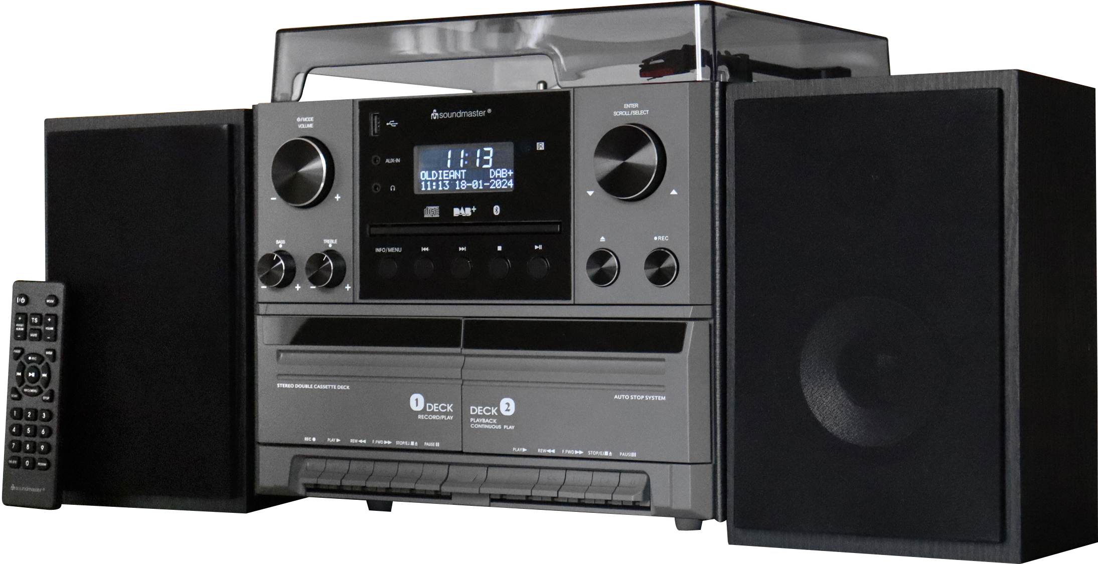 Impianto stereo con lettore CD, deck per cassette e altoparlanti. Telecomando a sinistra.