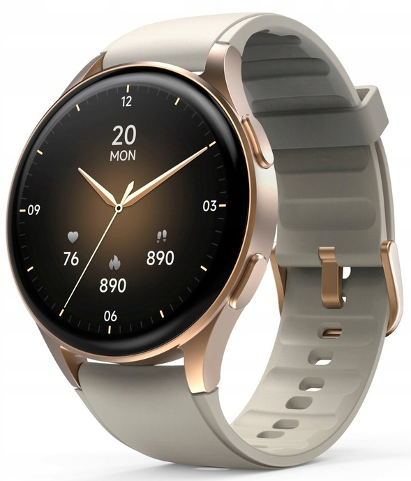 Smartwatch z okrągłą tarczą wyświetla datę i godzinę. Zegarek ma beżowy pasek i złotą ramkę.