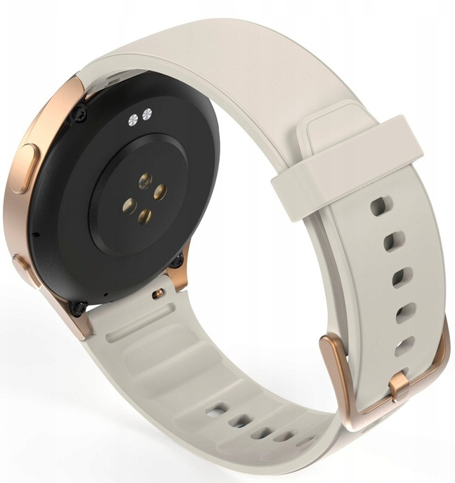 Zbliżenie smartwatcha. Ma czarny tył z czujnikami, jasnobeżowy pasek i złote krawędzie.