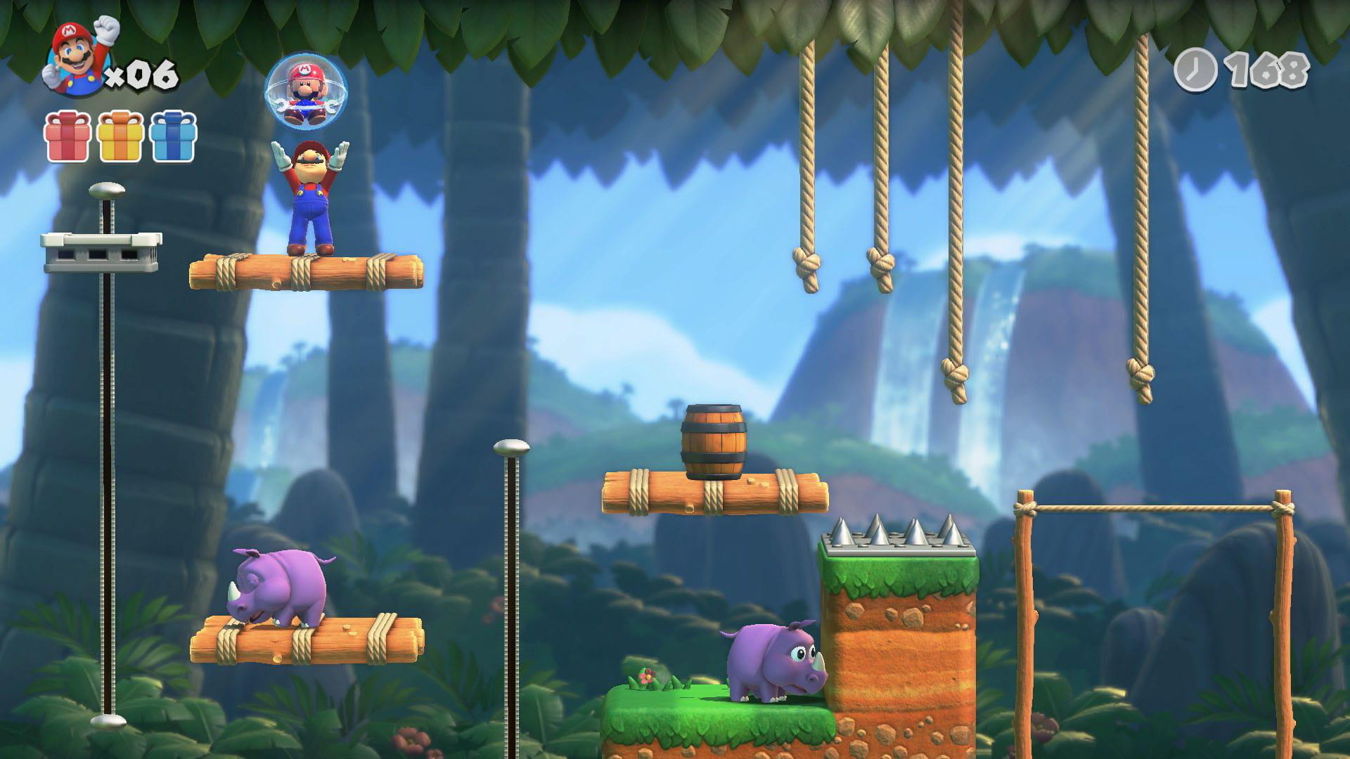 Mario in einem Dschungel-Level mit Plattformen, Fässern und Nilpferden.