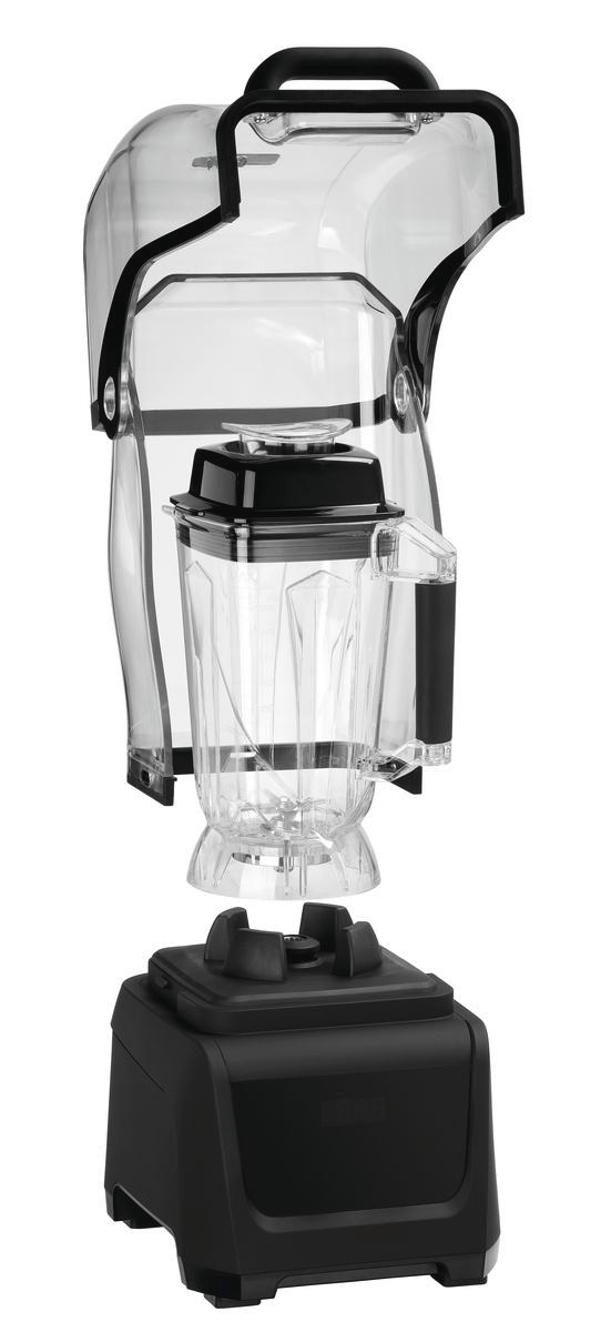 Ein zerlegter Mixer mit transparentem Behälter, schwarzem Griff und Sockel. Der Sockel ist schwarz. Der Deckel ist auch schwarz.