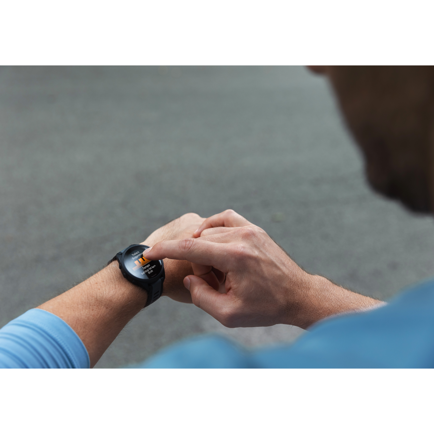 Person using smartwatch, touching screen on arm.
