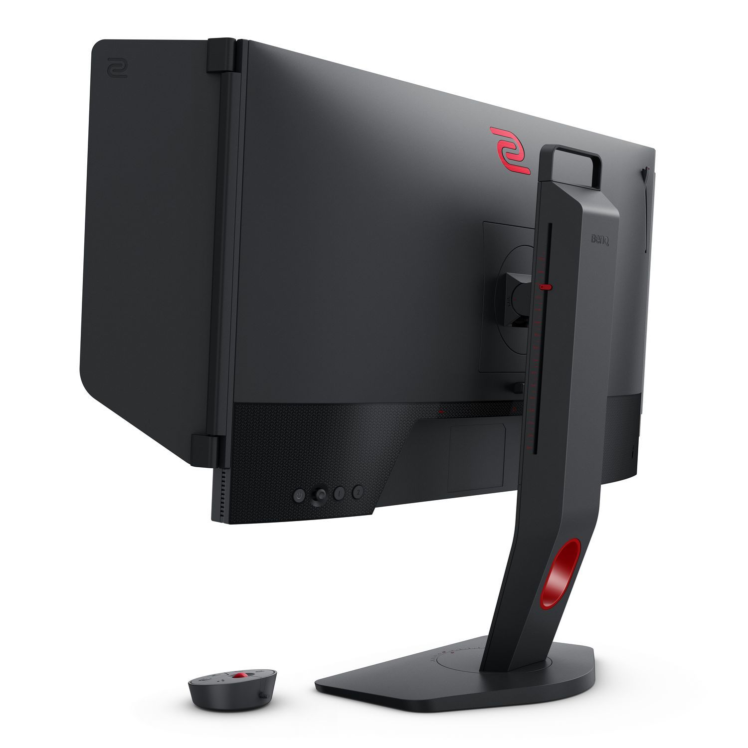 Moniteur d'ordinateur noir, vue latérale, avec des touches de rouge. Une petite manette est au premier plan. Logo BenQ visible.
