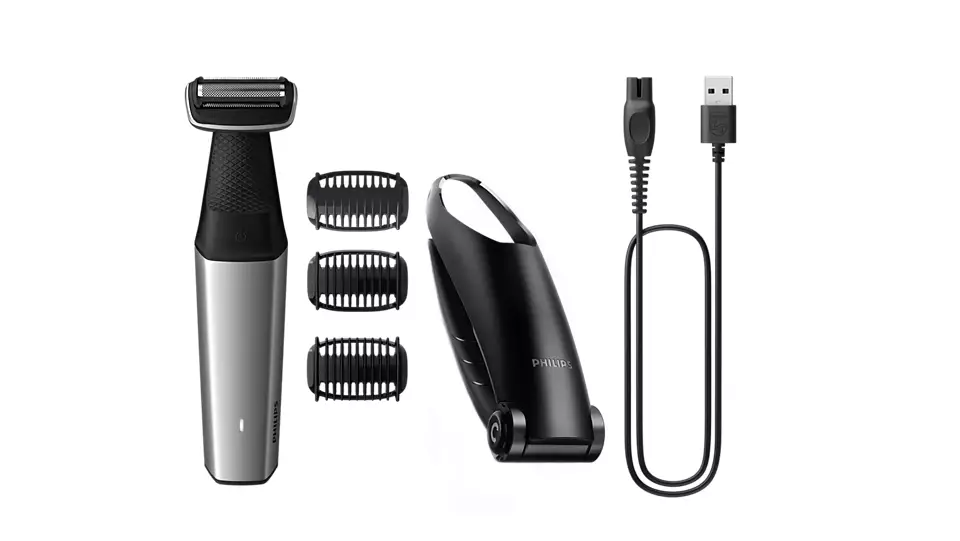 Egy ezüst-fekete Philips body groomer, tartozékok és egy USB töltőkábel.