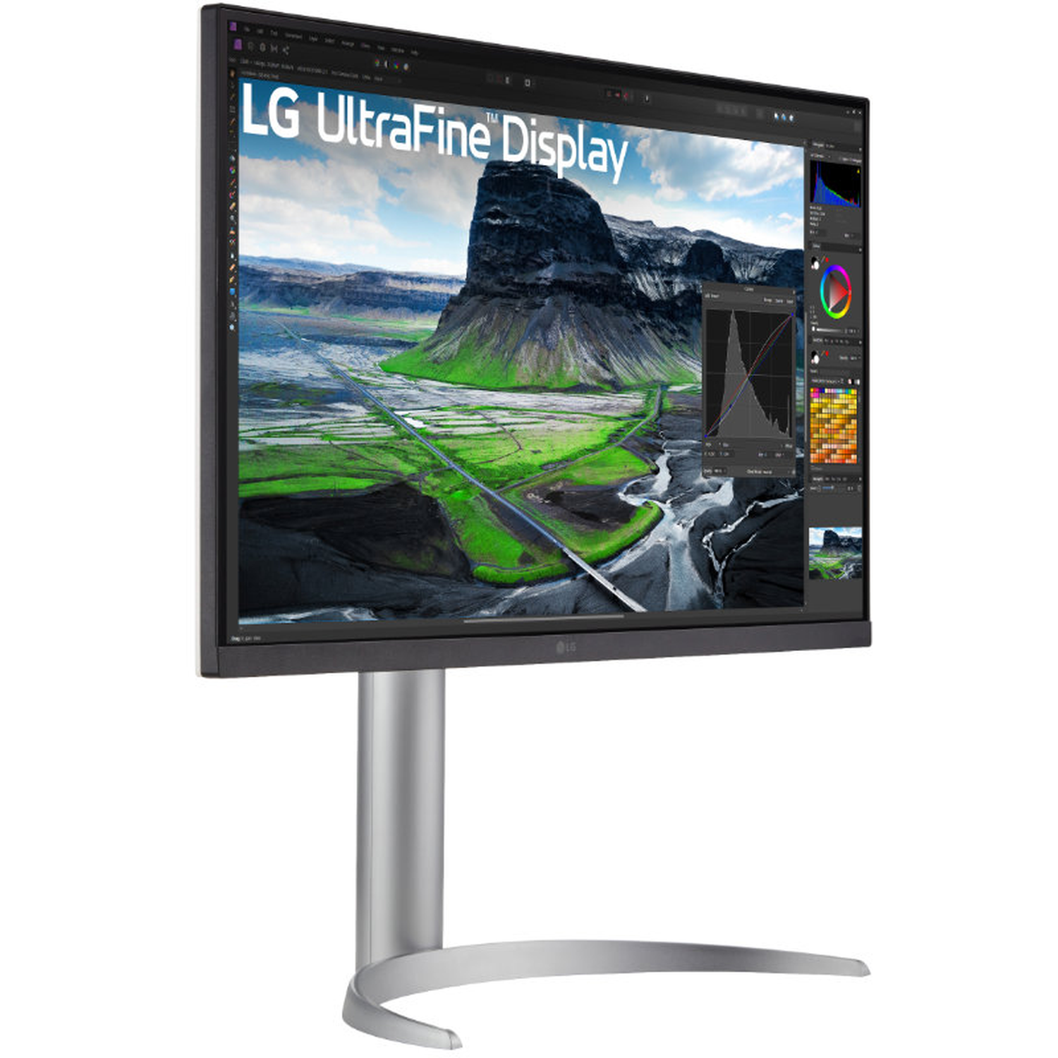An LG UltraFine Display monitor. The screen displays a landscape with mountains, green fields, and a river. It has a silver stand.