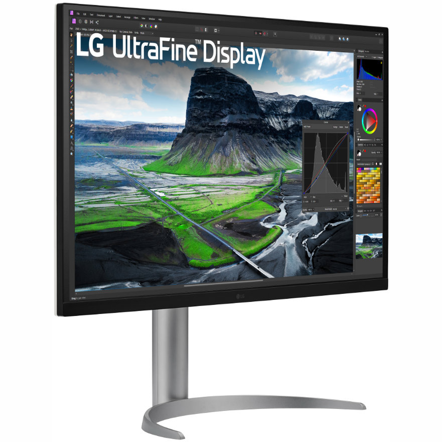 An LG UltraFine display shows a landscape with mountains and a road. The monitor is on a silver stand, white background.