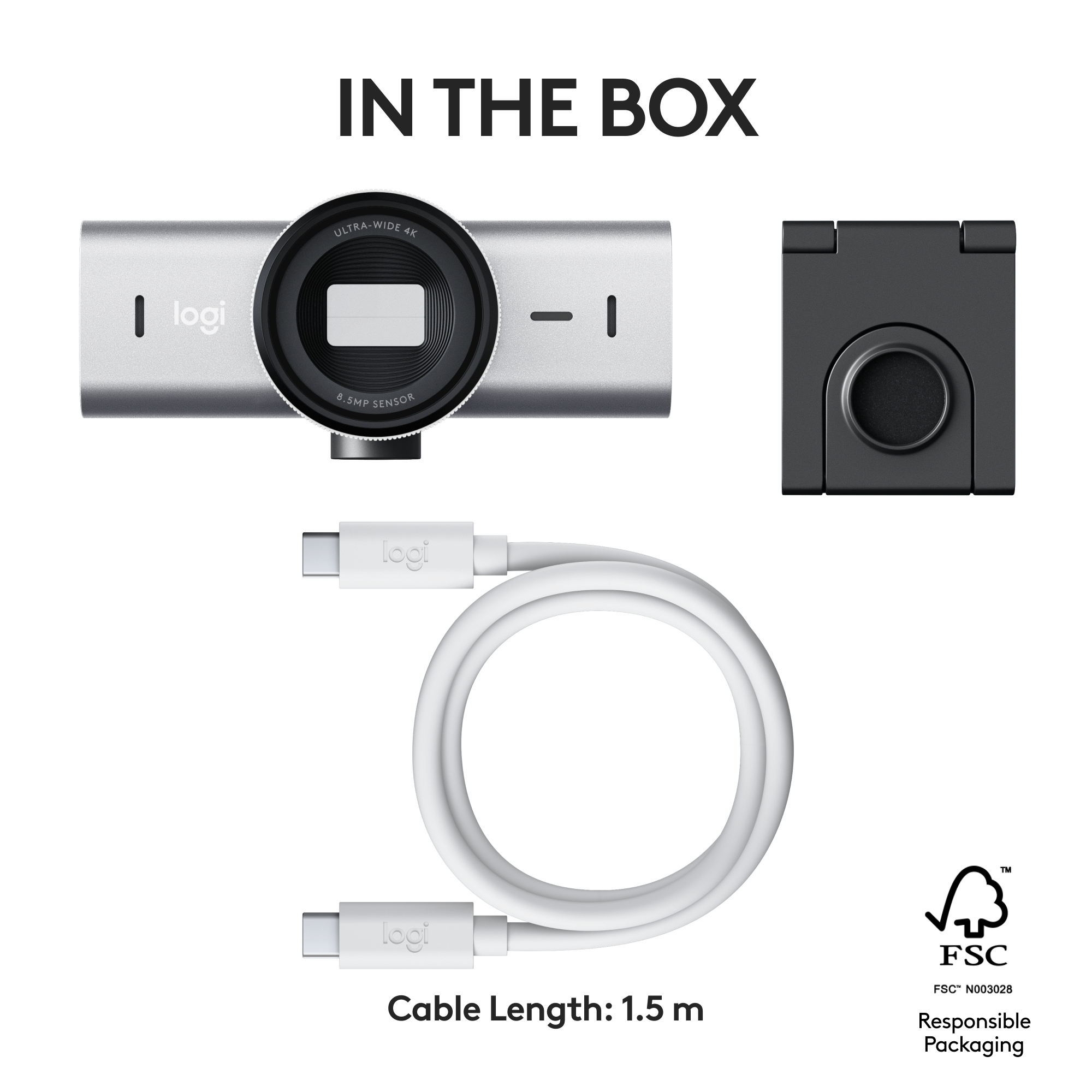 Una webcam e accessori sono in una scatola. Un cavo e un supporto sono visibili.