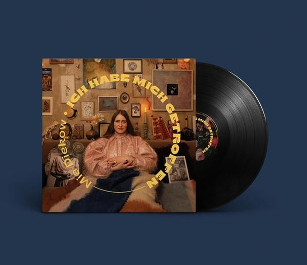 Vinyl-Schallplattencover mit einer Frau auf einem Sofa. Text lautet 'Ich habe mich getroffen' in Gold.