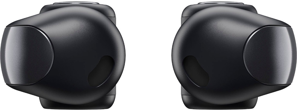 Two black earbuds, close-up view. The earbuds are facing each other.