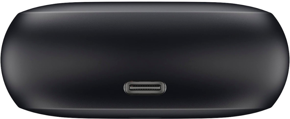 A close-up of a black charging case with a USB-C port, showing the port's details and the case's rounded shape.