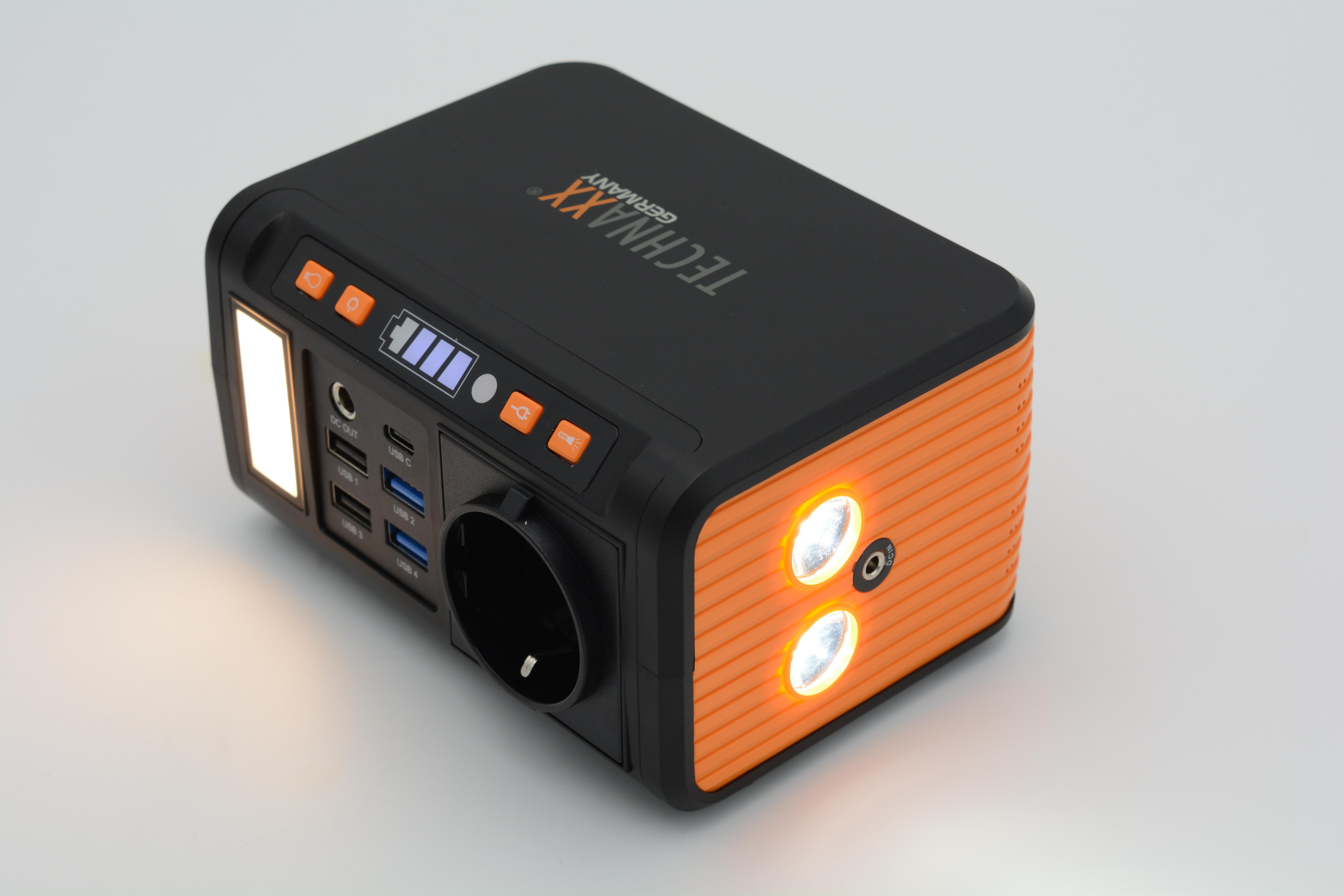 Schwarz-orange Powerstation mit Lichtern und Steckdosen. Zeigt den Batteriestand an.
