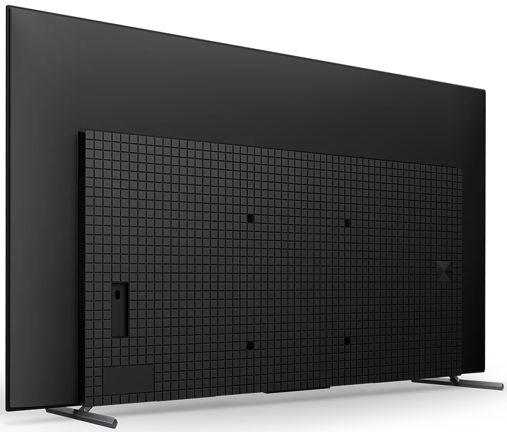 Osoba trzyma filiżankę kawy, z której wydobywa się para.