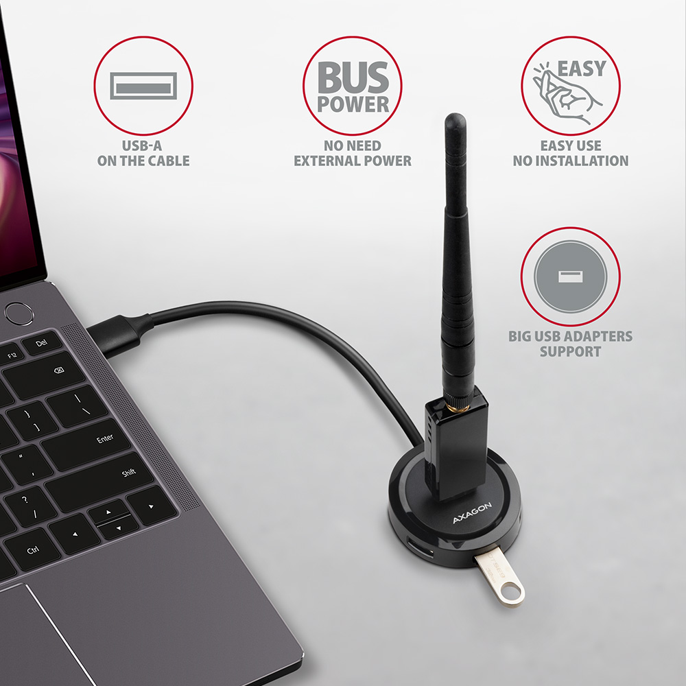Fekete USB Wi-Fi adapter laptophoz csatlakoztatva, funkcióit jelző ikonokkal.
