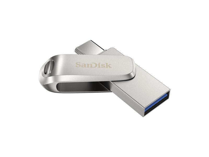 Silberner Sandisk USB-Stick. Silbernes Gehäuse mit Schiebemechanismus. USB-Anschluss sichtbar.