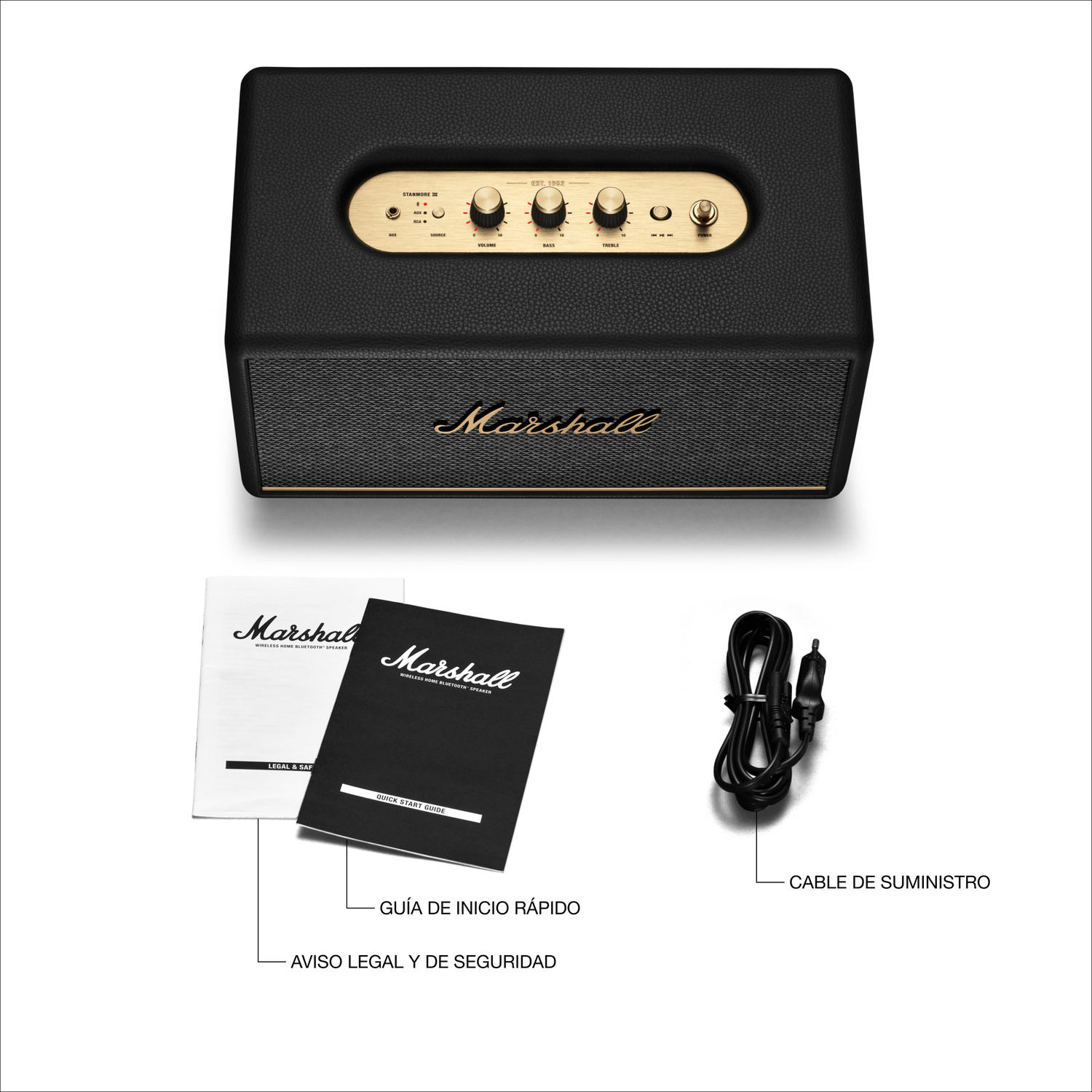 Altavoz negro Marshall con perillas y logotipo dorados, además de manuales y cable de alimentación.