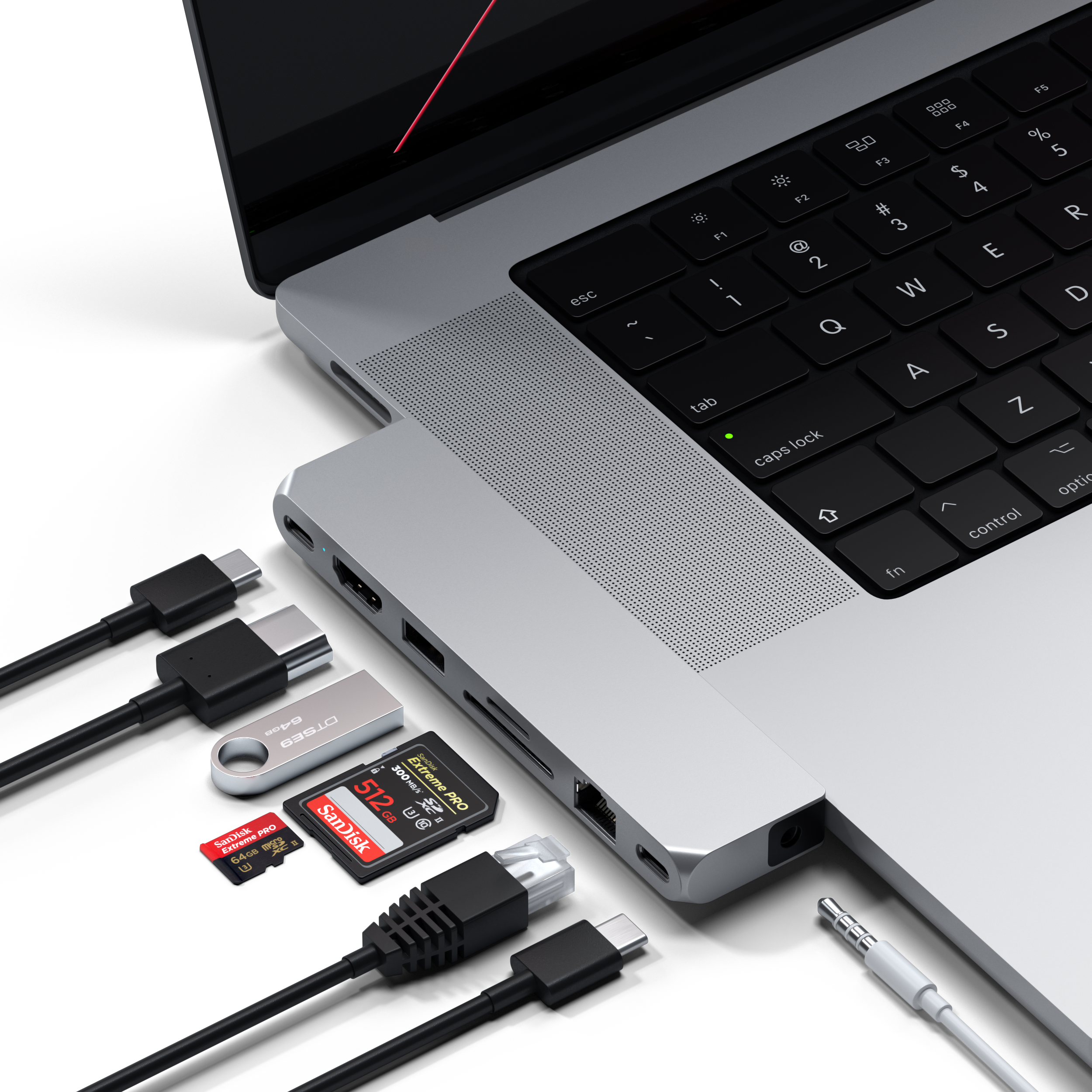 Egy laptophoz csatlakoztatott különböző USB-eszközök, köztük egy pendrive és SD-kártyák.