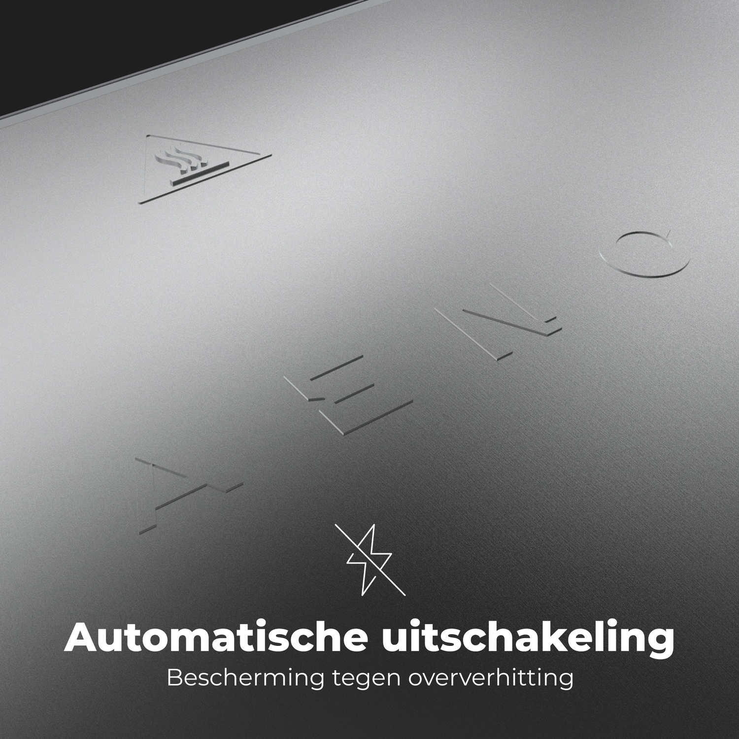 Close-up of a silver surface with embossed symbols and text.