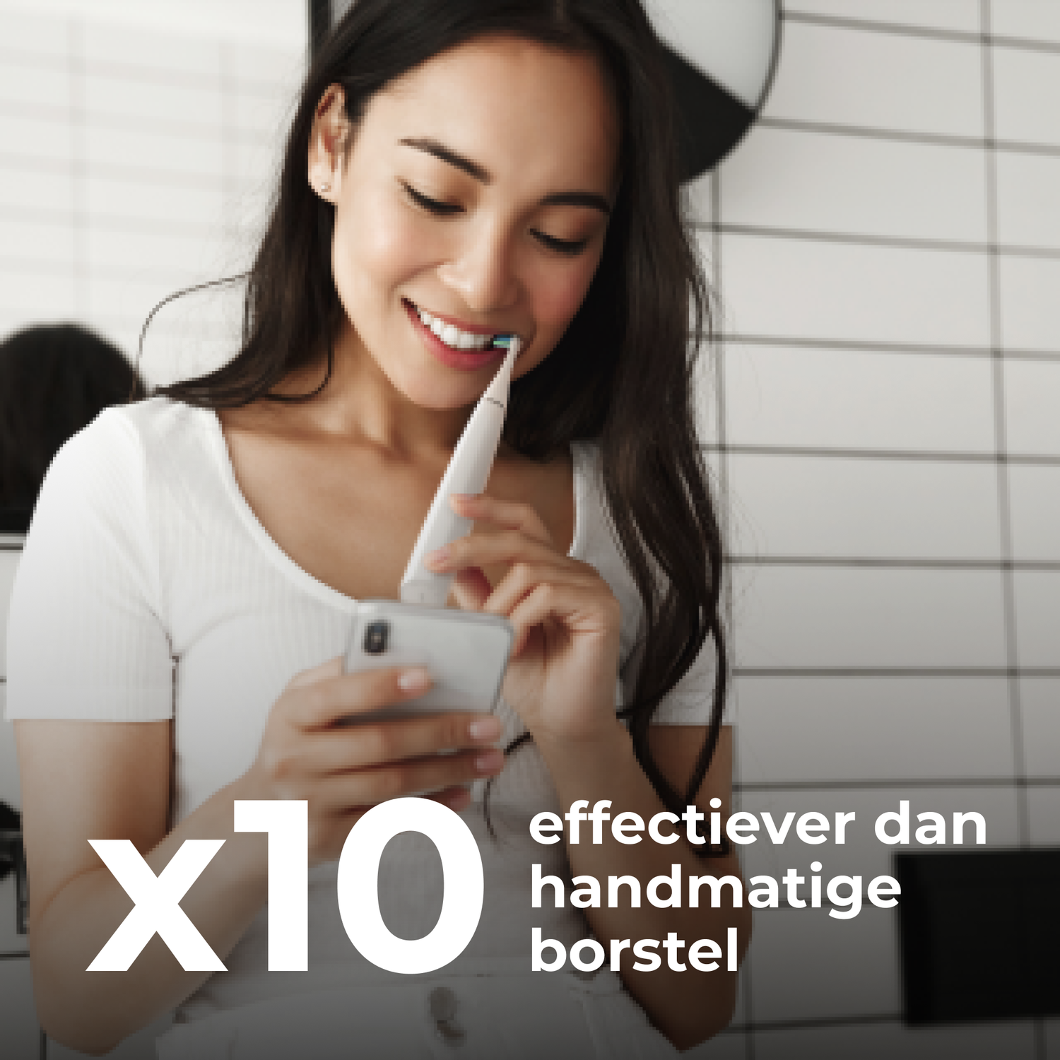 Woman using a smartphone while brushing her teeth with an electric toothbrush. Text: x10, more effective.
