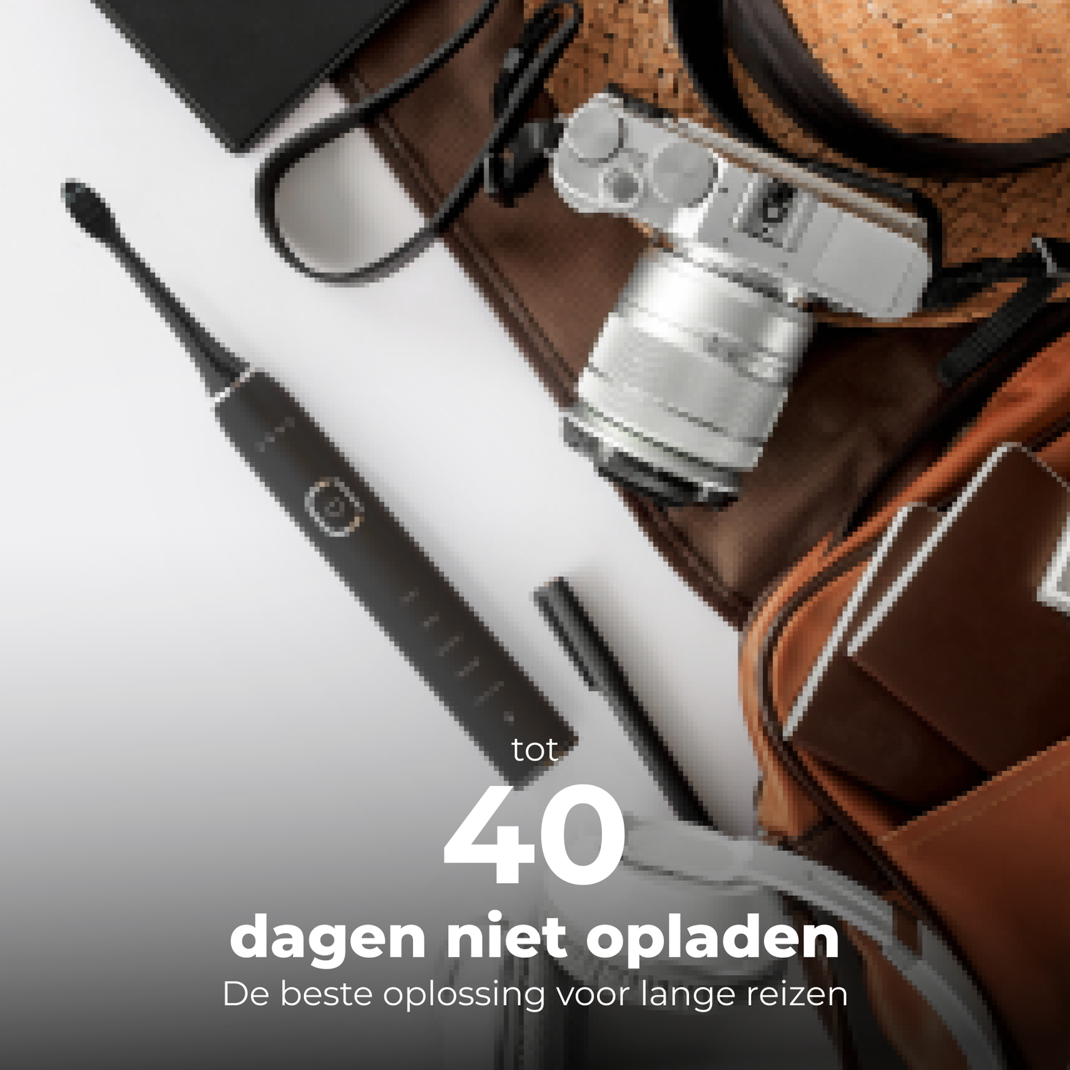 Black electric toothbrush, travel bag, camera, hat, and other travel items are on white.