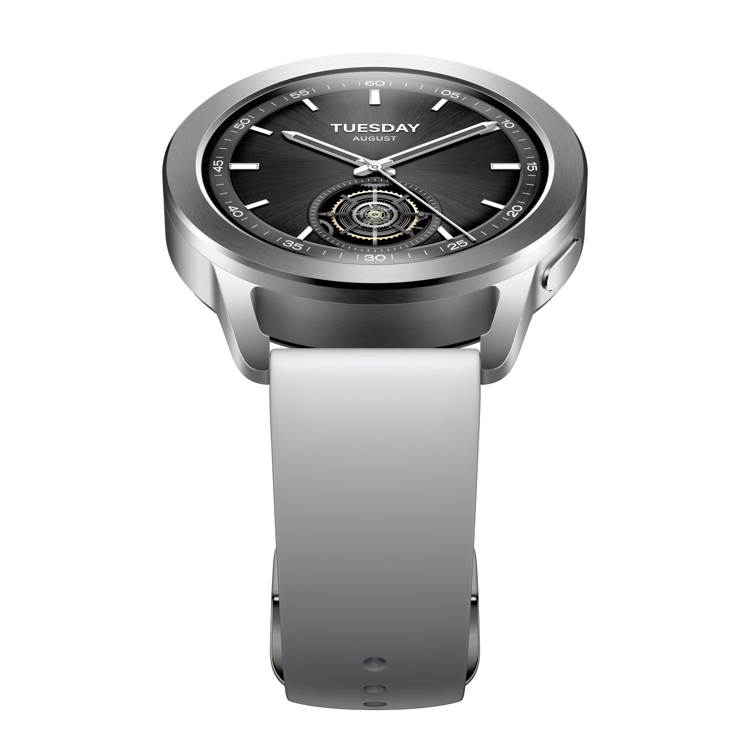 Silberne Smartwatch mit schwarzem Zifferblatt, weißem Band, Draufsicht, weißer Hintergrund.
