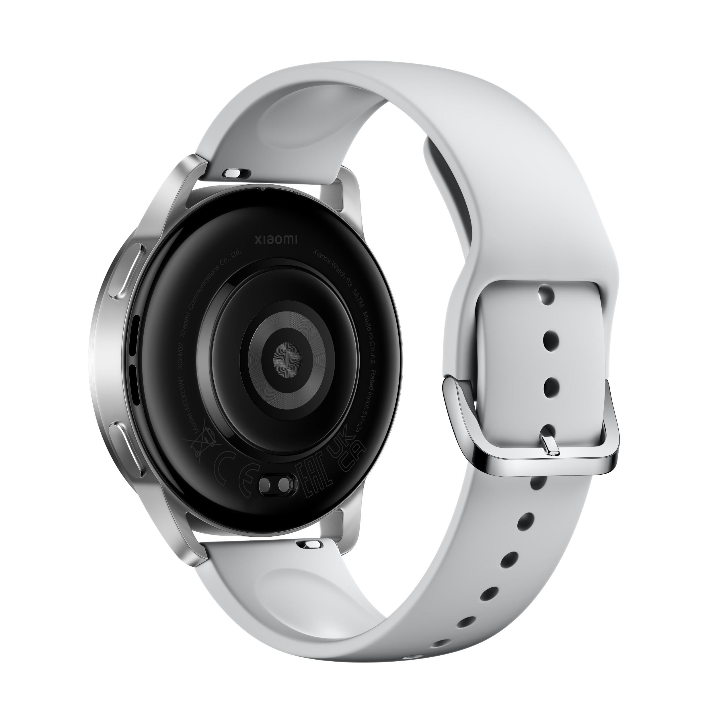 Eine silberne Smartwatch mit weißem Armband, von hinten betrachtet.