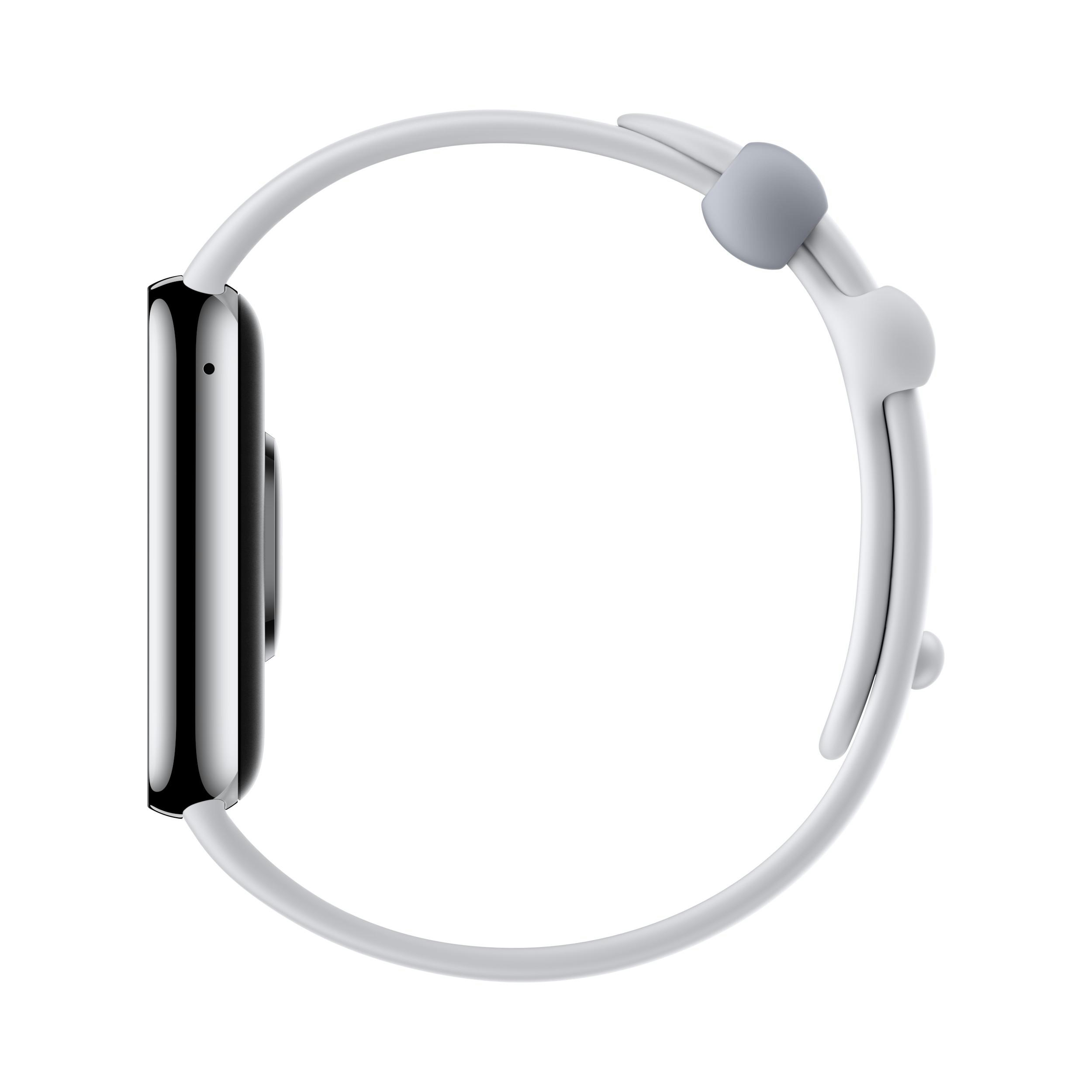 Eine weiße Smartwatch mit weißem Armband, Seitenansicht, auf weißem Hintergrund. Der Bildschirm ist dunkel.