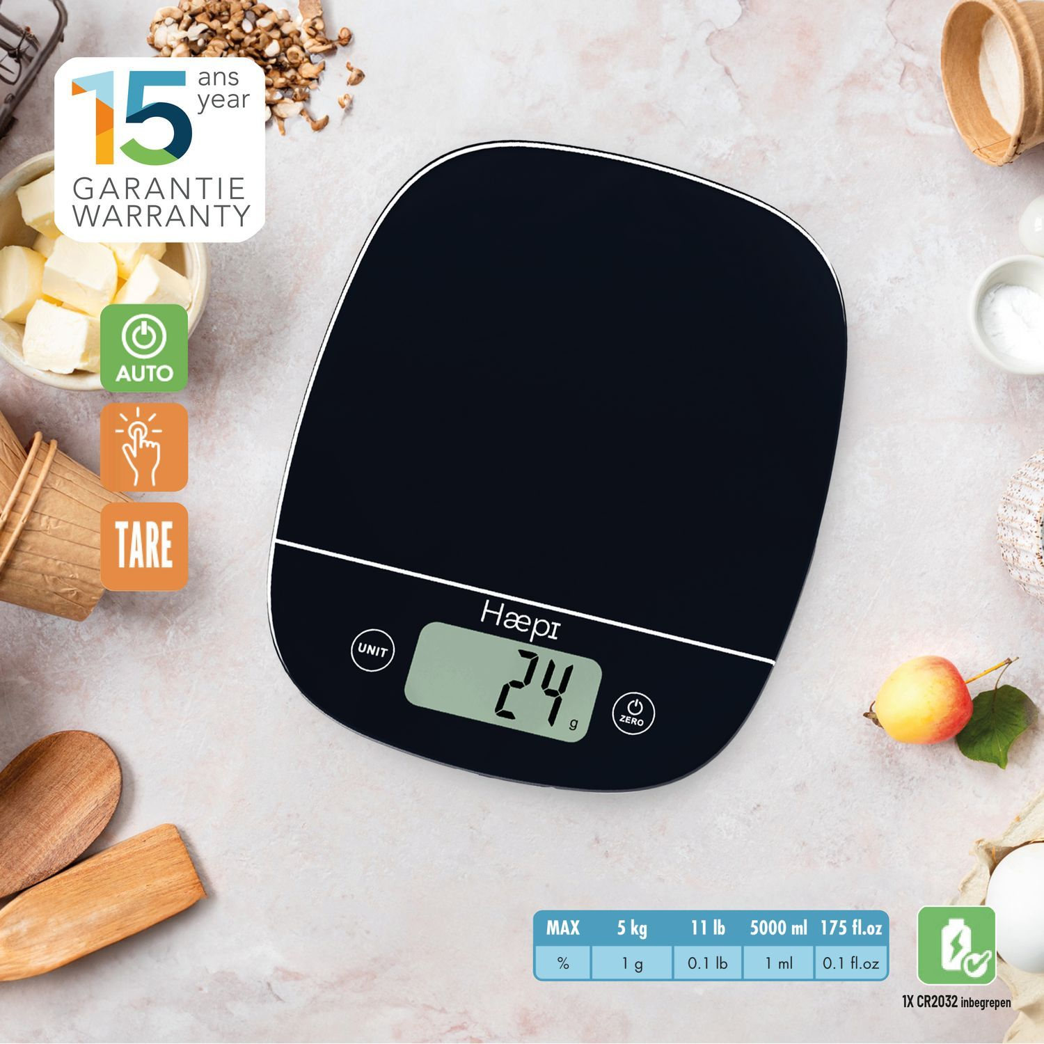 Black digital kitchen scale with eggs, butter, and text: 15 ans garantie warranty.