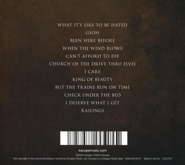 Album-Rückseite mit Silhouette eines Mannes und Songtiteln.