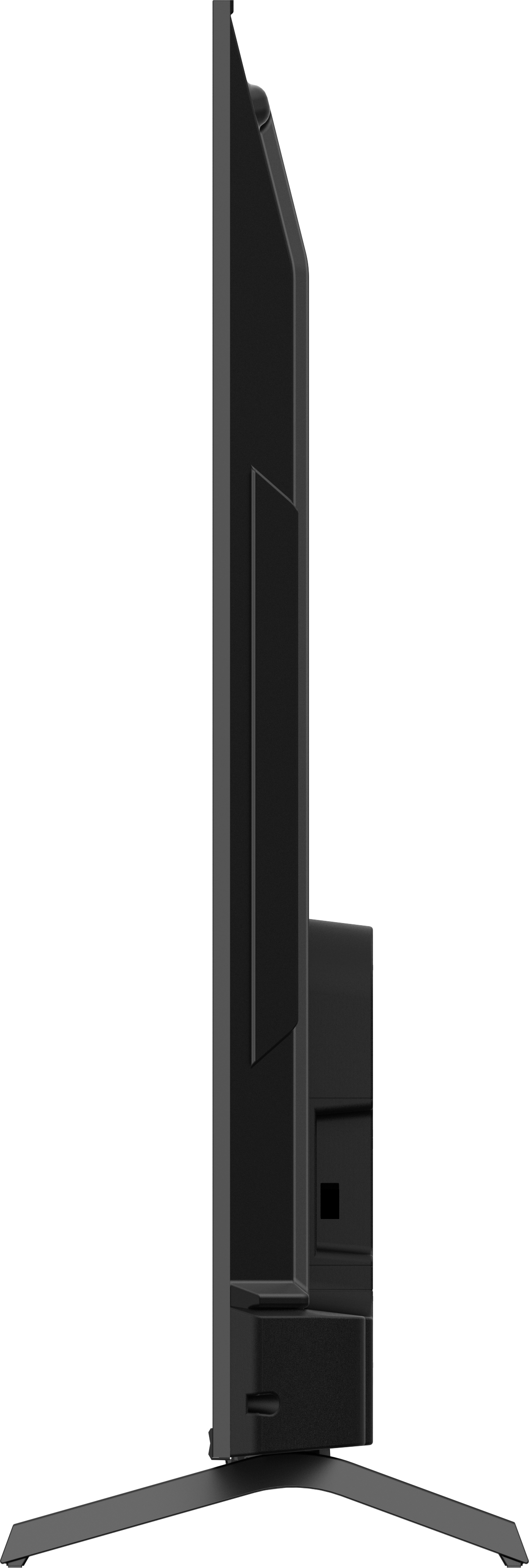 Ein großer, gebogener Computermonitor zeigt einen Sonnenuntergang über einer Felslandschaft.