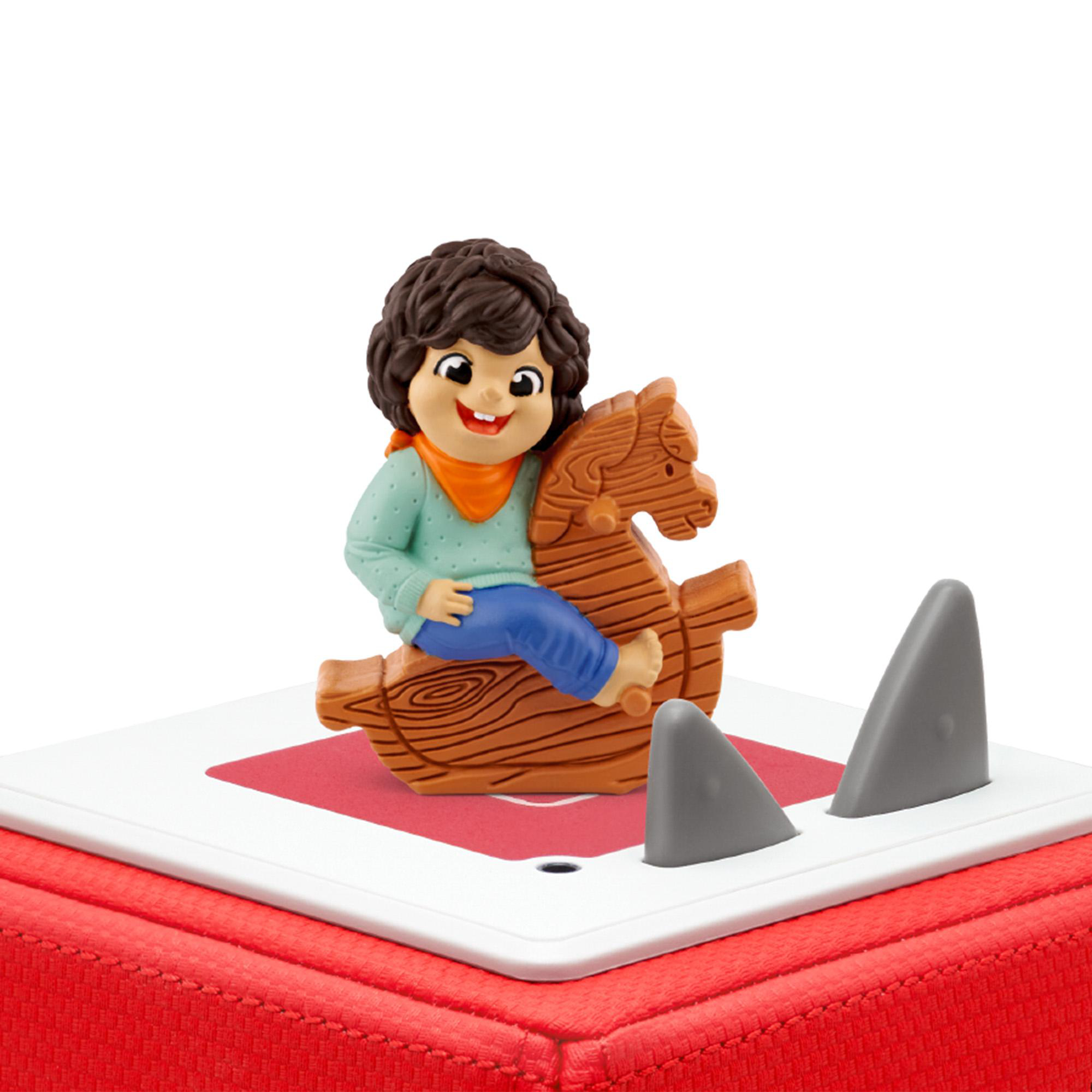 Eine Spielfigur eines Kindes auf einem Schaukelpferd auf roter und weißer Basis.
