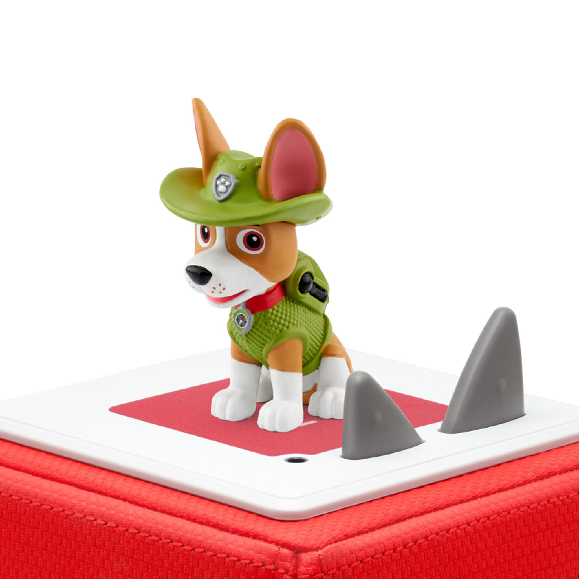 Eine Spielfigur eines Hundes mit Hut auf roter und weißer Basis.
