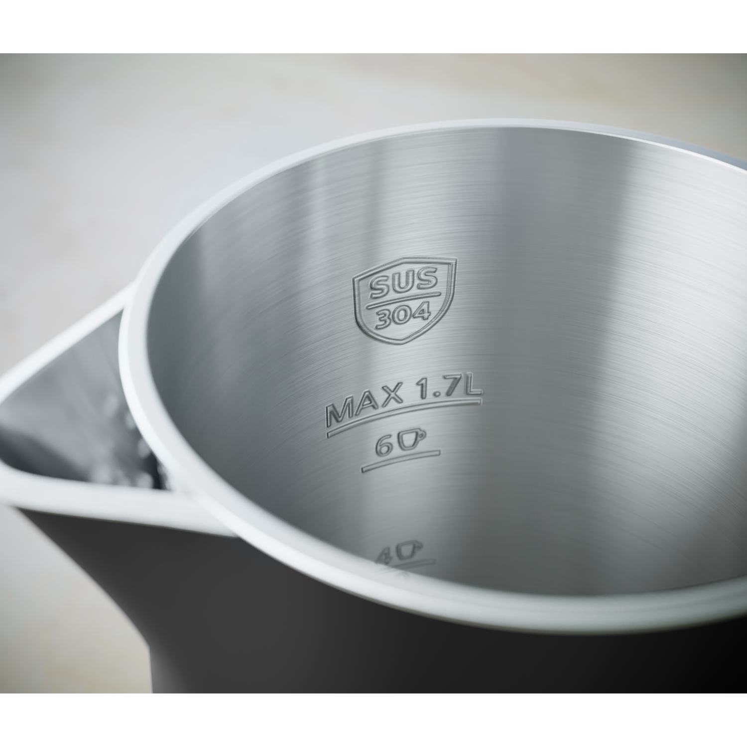 Interior of a kettle showing markings. Stainless steel, max 1.7L, and other text.