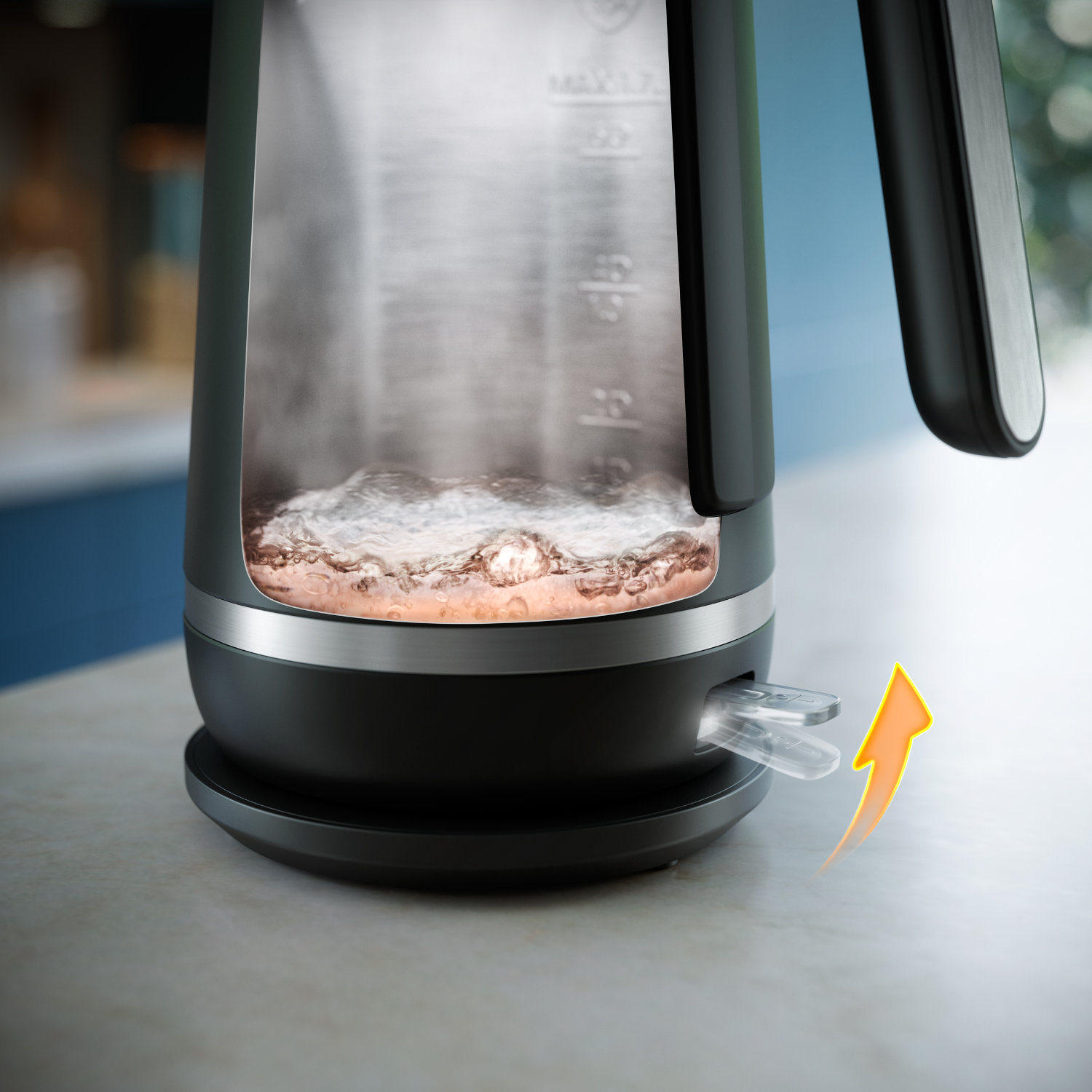 A cutaway view of a black electric kettle with steam and water inside.