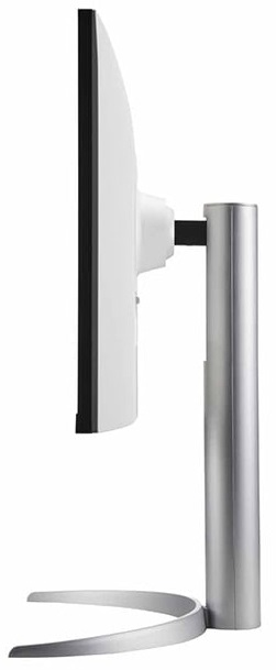 Widok z boku monitora komputerowego. Monitor jest biały z metalową podstawą.