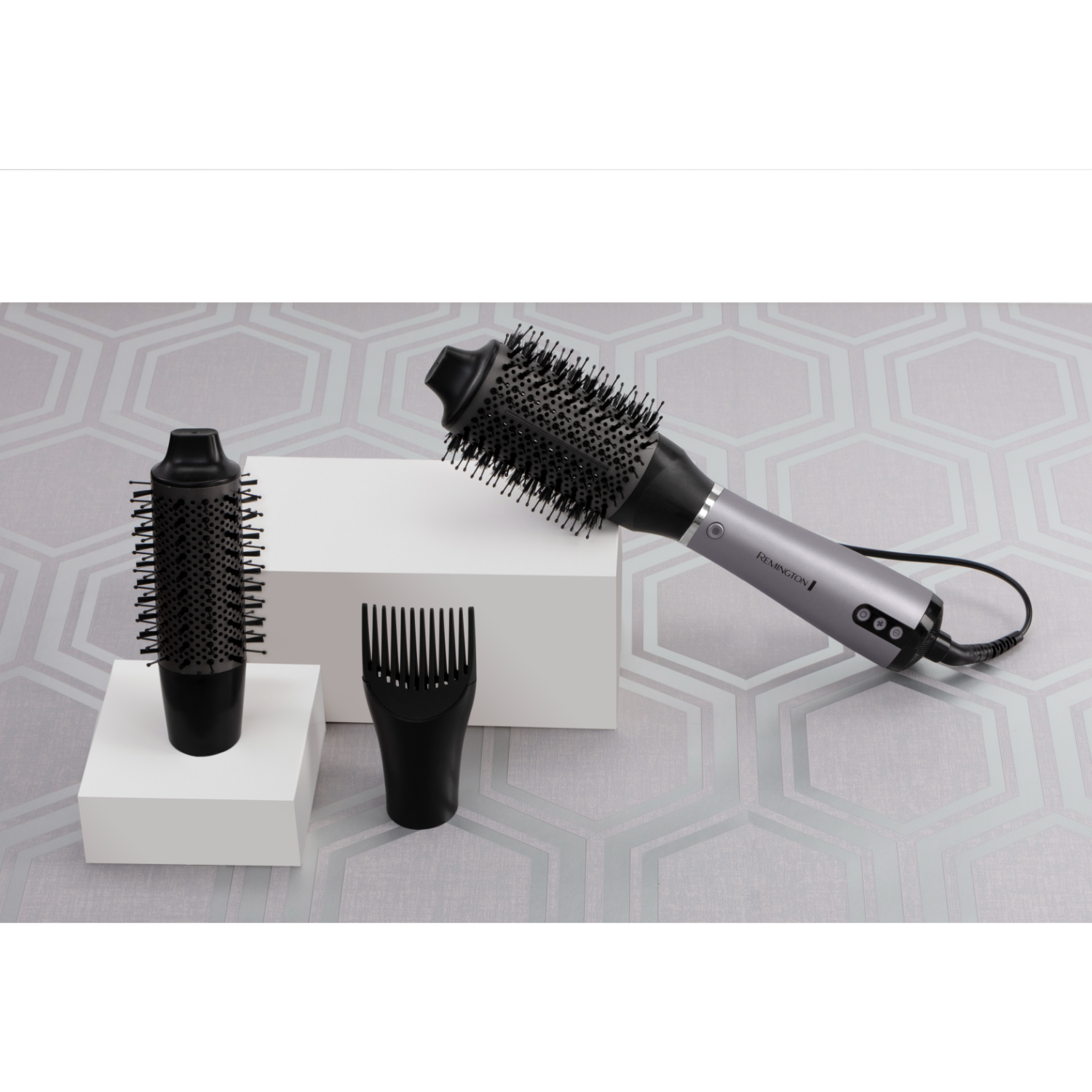 Hair styling tools. Hairbrush, comb, and brush head on a white box. Hexagon background.