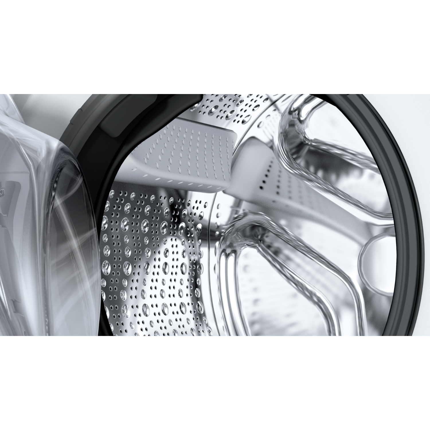 Inside a washing machine, with the door open. Shows the drum and water droplets.