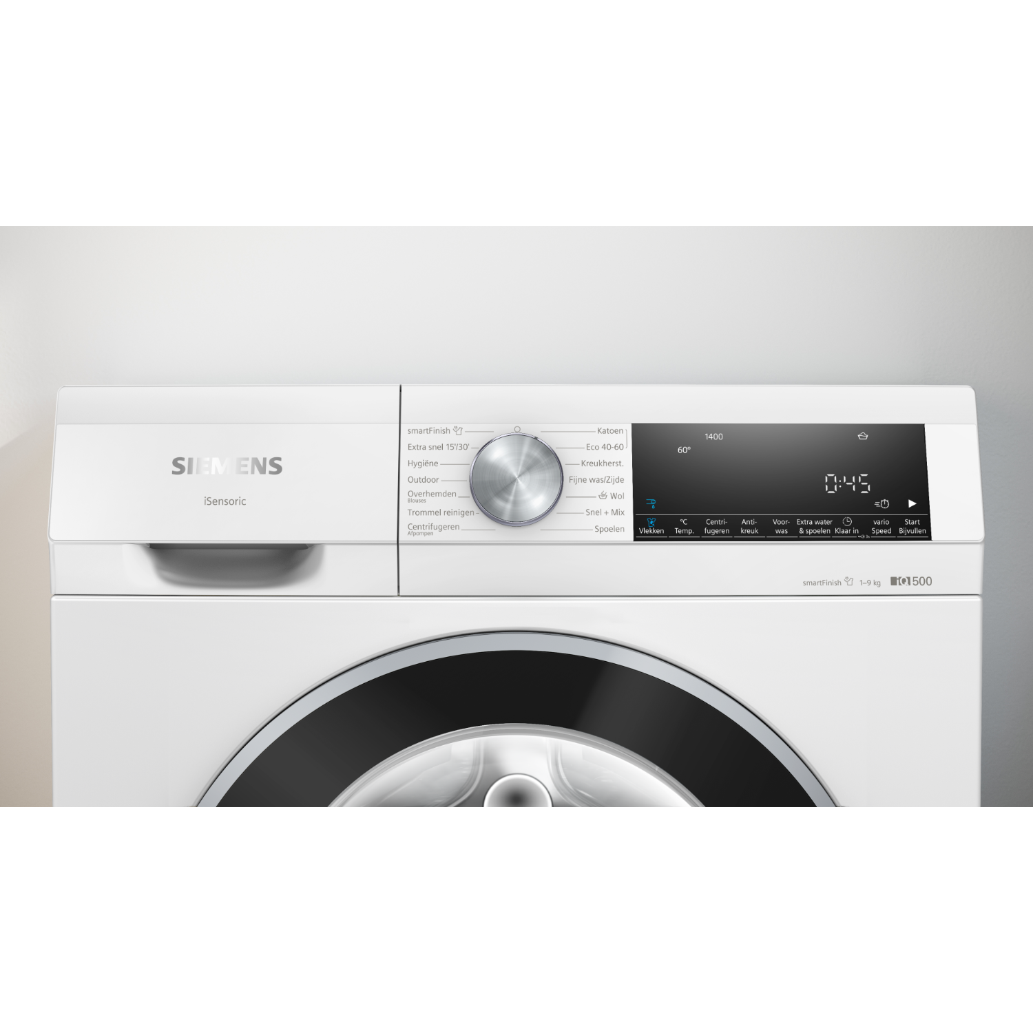 Washing machine control panel with a dial and a digital display showing the time.
